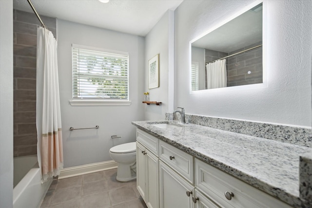 5402 Indigo St, Houston, TX 77096 - full bath with vanity, toilet, baseboards, shower / bath combo with shower curtain, and tile patterned floors
