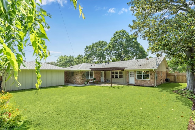 5402 Indigo St, Houston, TX 77096 - rear view of house featuring brick siding, a patio, and roof with shingles