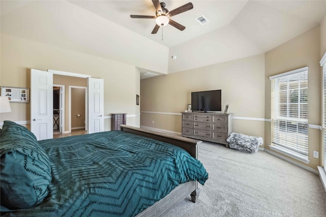 carpeted bedroom featuring vaulted ceiling and a ceiling fan