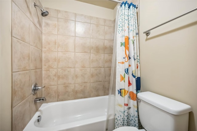full bathroom featuring shower / bath combo and toilet