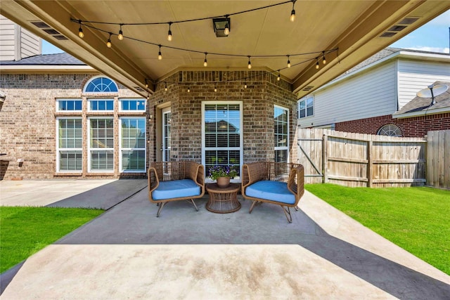 view of patio / terrace featuring fence