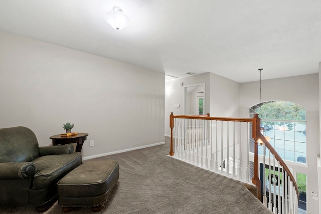 6503 Ambercrest Ct, Spring, TX 77389 - living area with carpet flooring, an upstairs landing, and baseboards