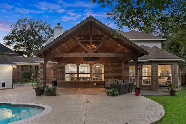 6503 Ambercrest Ct, Spring, TX 77389 - rear view of property featuring brick siding, a patio, and outdoor lounge area