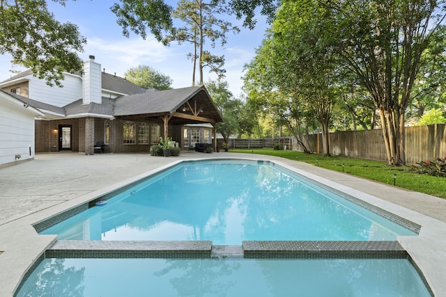 6503 Ambercrest Ct, Spring, TX 77389 - view of pool featuring a pool with connected hot tub, a patio area, and a fenced backyard