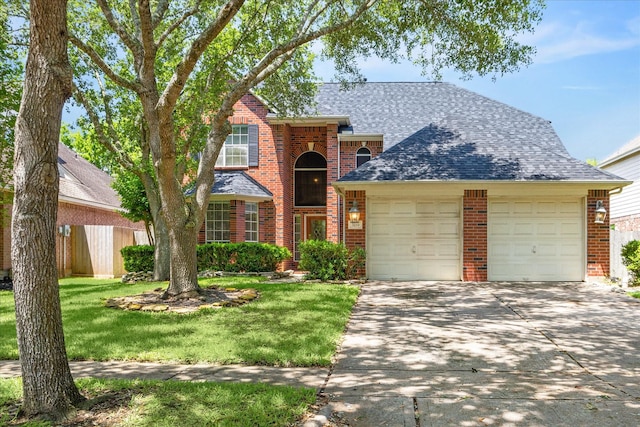 3119 Five Oaks Dr, Missouri City, TX 77459 - traditional-style home featuring brick siding, a garage, concrete driveway, roof with shingles, and a front lawn