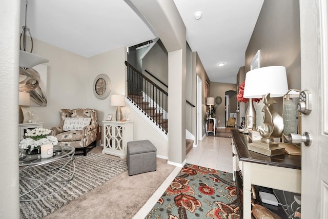 9703 Tipton Sands Dr, Humble, TX 77396 - foyer entrance with arched walkways, stairs, baseboards, and tile patterned flooring