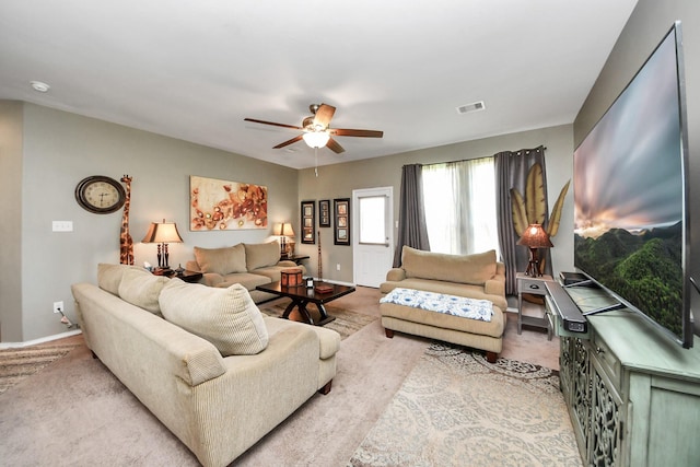 9703 Tipton Sands Dr, Humble, TX 77396 - living room with carpet flooring, ceiling fan, and baseboards