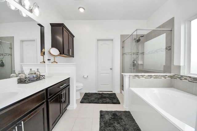 9703 Tipton Sands Dr, Humble, TX 77396 - full bathroom featuring a shower stall, tile patterned floors, toilet, vanity, and a bath