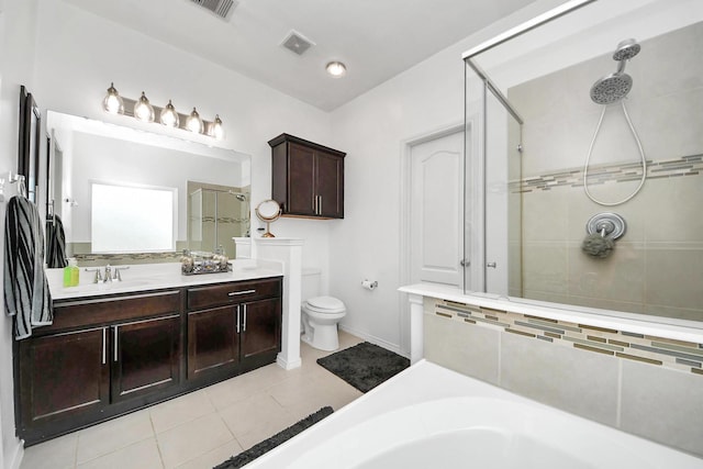 9703 Tipton Sands Dr, Humble, TX 77396 - bathroom featuring a stall shower, tile patterned floors, toilet, double vanity, and baseboards