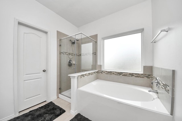 9703 Tipton Sands Dr, Humble, TX 77396 - full bathroom with a shower stall, a garden tub, and tile patterned flooring