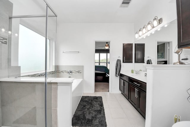 9703 Tipton Sands Dr, Humble, TX 77396 - bathroom with ensuite bathroom, a stall shower, a bath, vanity, and tile patterned floors
