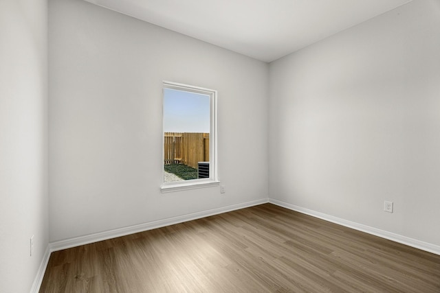 377 Tejas Trl, Waller, TX 77484 - empty room with wood finished floors and baseboards