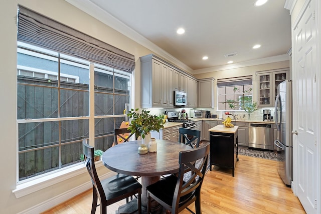 3219 N Pemberton Circle Dr, Houston, TX 77025 - dining room with ornamental molding, light wood-style floors, and recessed lighting