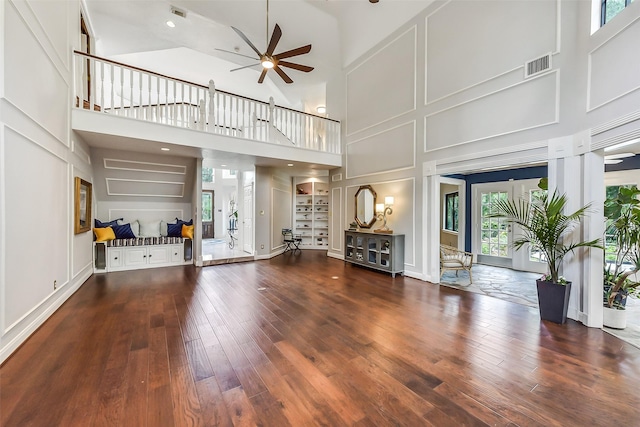 3230 Ivy Falls Dr, Houston, TX 77068 - living area with a towering ceiling, a ceiling fan, and wood-type flooring