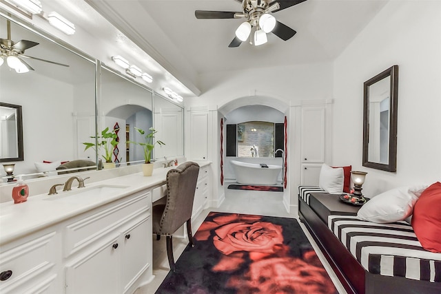 3230 Ivy Falls Dr, Houston, TX 77068 - bathroom with ceiling fan, a freestanding tub, and vanity