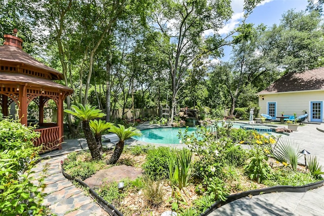 3230 Ivy Falls Dr, Houston, TX 77068 - swimming pool with a gazebo, a patio, and view of scattered trees