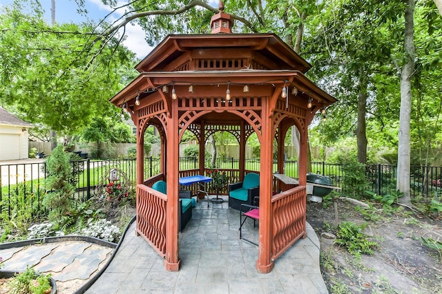 3230 Ivy Falls Dr, Houston, TX 77068 - view of patio featuring a gazebo, an outdoor hangout area, and a fenced backyard