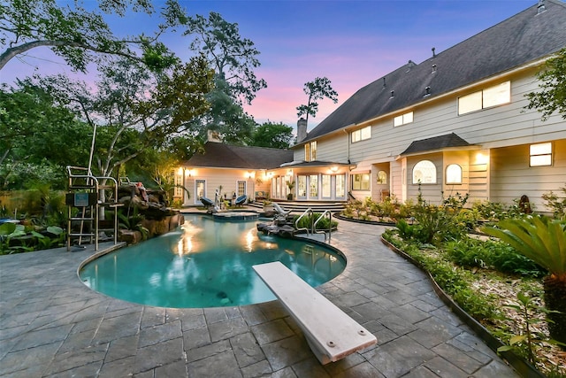3230 Ivy Falls Dr, Houston, TX 77068 - view of swimming pool with a patio, a pool with connected hot tub, and a diving board
