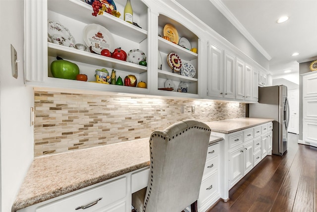 3230 Ivy Falls Dr, Houston, TX 77068 - office area with recessed lighting, dark wood-type flooring, crown molding, and built in desk