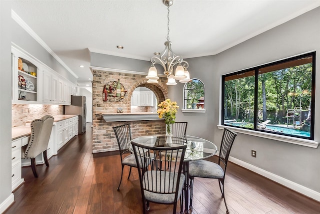 3230 Ivy Falls Dr, Houston, TX 77068 - dining room featuring baseboards, ornamental molding, a chandelier, dark wood-style flooring, and recessed lighting