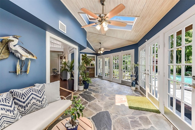 3230 Ivy Falls Dr, Houston, TX 77068 - sunroom / solarium featuring french doors, vaulted ceiling, and a skylight