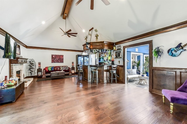 3230 Ivy Falls Dr, Houston, TX 77068 - living room featuring ceiling fan, beam ceiling, high vaulted ceiling, a fireplace, and wood finished floors