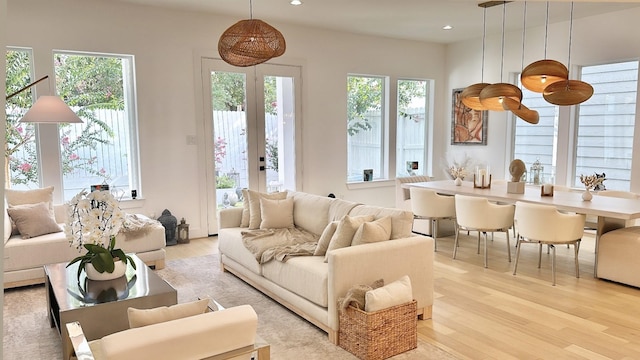 1918 Hoskins Dr, Houston, TX 77080 - living room featuring light wood finished floors, plenty of natural light, recessed lighting, and french doors