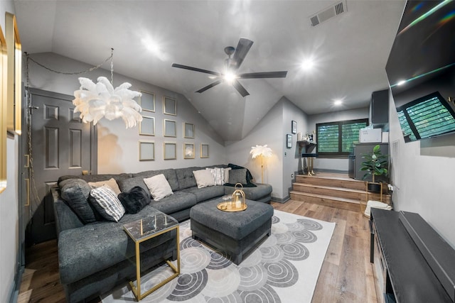 1924 Boulder Ridge Dr, Conroe, TX 77304 - living area with vaulted ceiling, a chandelier, ceiling fan, and wood finished floors