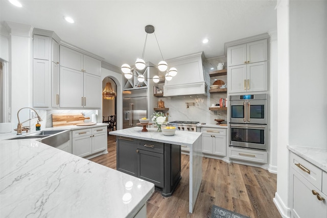 1924 Boulder Ridge Dr, Conroe, TX 77304 - kitchen featuring appliances with stainless steel finishes, a sink, tasteful backsplash, open shelves, and recessed lighting