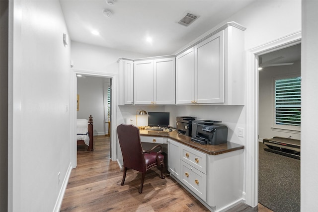 1924 Boulder Ridge Dr, Conroe, TX 77304 - office space with built in study area and light wood finished floors