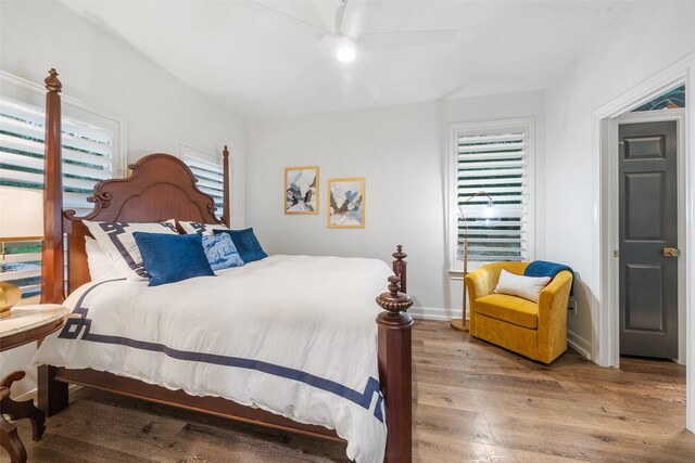 1924 Boulder Ridge Dr, Conroe, TX 77304 - bedroom with wood finished floors, ceiling fan, and baseboards