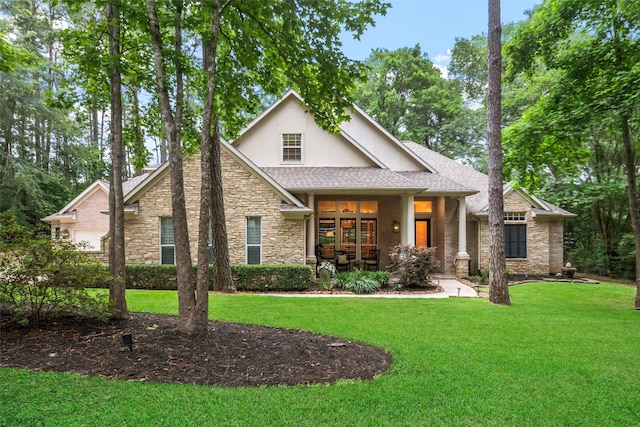 1924 Boulder Ridge Dr, Conroe, TX 77304 - view of front of house featuring stone siding, stucco siding, a front yard, and roof with shingles