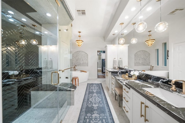 1924 Boulder Ridge Dr, Conroe, TX 77304 - full bathroom featuring double vanity, a shower stall, a freestanding tub, and recessed lighting
