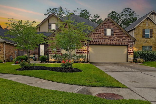 514 Pearl View Ln, Pinehurst, TX 77362 - view of front facade featuring concrete driveway, stone siding, a front yard, and brick siding