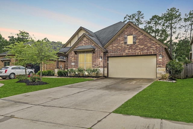 514 Pearl View Ln, Pinehurst, TX 77362 - view of front of house with brick siding, driveway, a front lawn, and a shingled roof