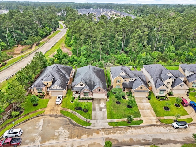 514 Pearl View Ln, Pinehurst, TX 77362 - aerial perspective of suburban area featuring a heavily wooded area