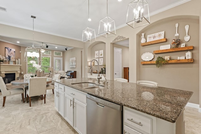 514 Pearl View Ln, Pinehurst, TX 77362 - kitchen with stainless steel dishwasher, a sink, open floor plan, ornamental molding, and white cabinetry
