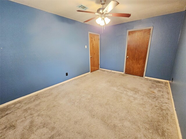 807 Golf Ct, Stafford, TX 77477 - unfurnished bedroom with carpet flooring, baseboards, and a ceiling fan