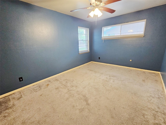 807 Golf Ct, Stafford, TX 77477 - unfurnished room featuring carpet, baseboards, and a ceiling fan