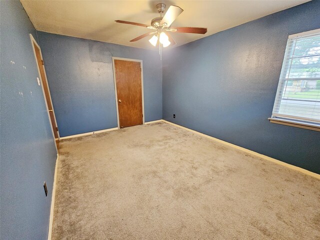807 Golf Ct, Stafford, TX 77477 - spare room with a ceiling fan, carpet flooring, and baseboards