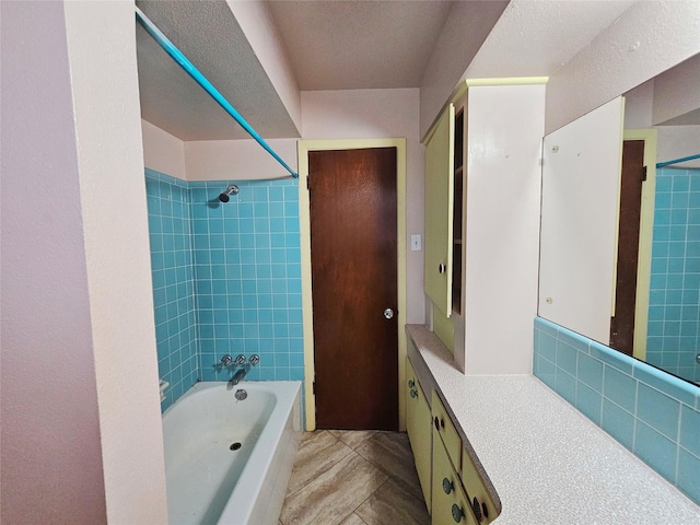 807 Golf Ct, Stafford, TX 77477 - bathroom with bathing tub / shower combination, vanity, and tile patterned flooring
