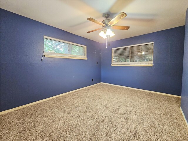 807 Golf Ct, Stafford, TX 77477 - spare room with carpet flooring, a ceiling fan, and baseboards