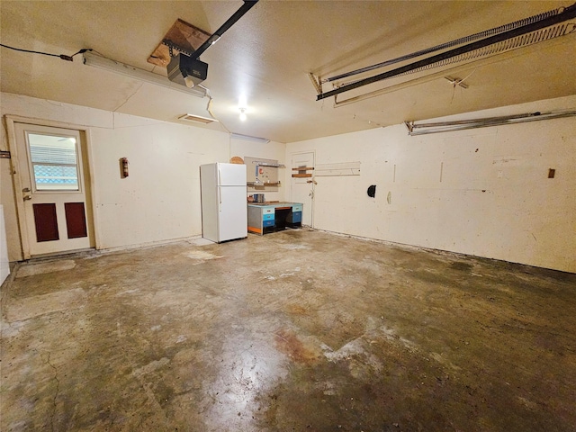 807 Golf Ct, Stafford, TX 77477 - garage with freestanding refrigerator and a garage door opener