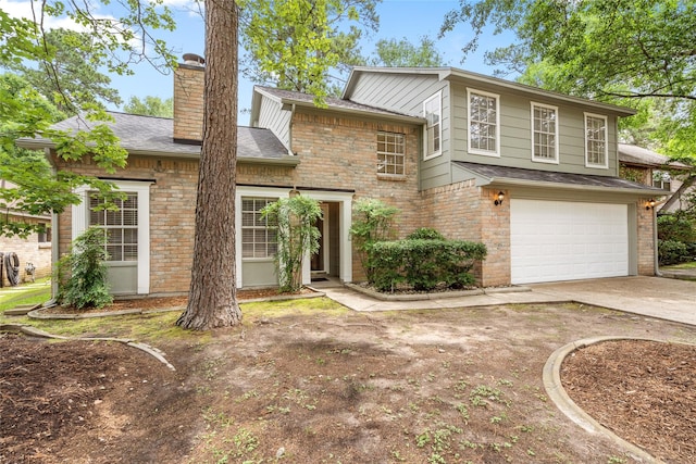 65 Hickory Oak Dr, The Woodlands, TX 77381 - view of front of home featuring concrete driveway, an attached garage, a chimney, a shingled roof, and brick siding