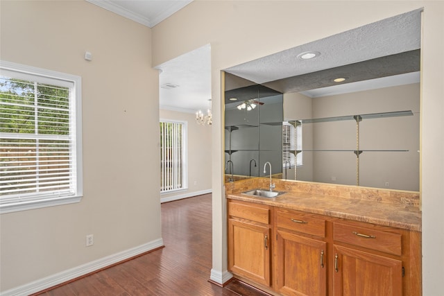 65 Hickory Oak Dr, The Woodlands, TX 77381 - bathroom featuring crown molding, wood finished floors, baseboards, and vanity