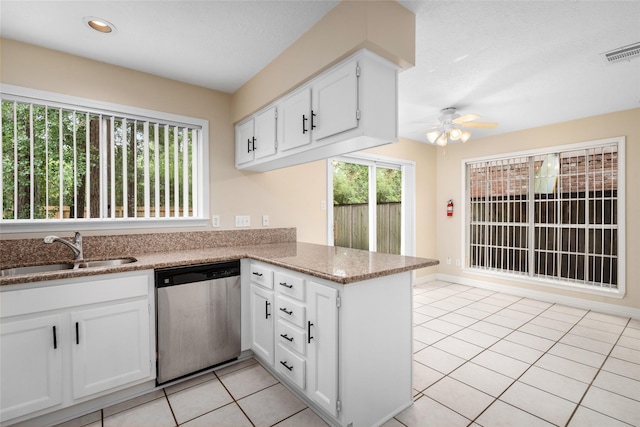 65 Hickory Oak Dr, The Woodlands, TX 77381 - kitchen featuring dishwasher, a sink, a peninsula, a ceiling fan, and white cabinets