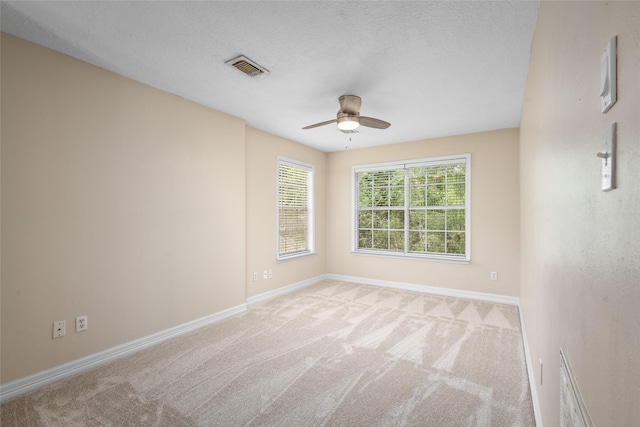 65 Hickory Oak Dr, The Woodlands, TX 77381 - empty room with ceiling fan, light colored carpet, and baseboards