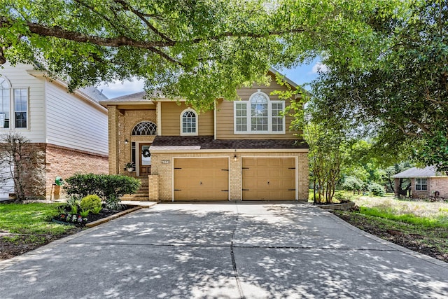 170 April Cv, Montgomery, TX 77356 - view of front of property featuring brick siding, concrete driveway, a garage, and a shingled roof
