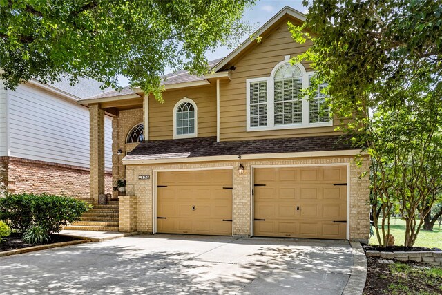 170 April Cv, Montgomery, TX 77356 - view of front of property featuring an attached garage, driveway, brick siding, and roof with shingles