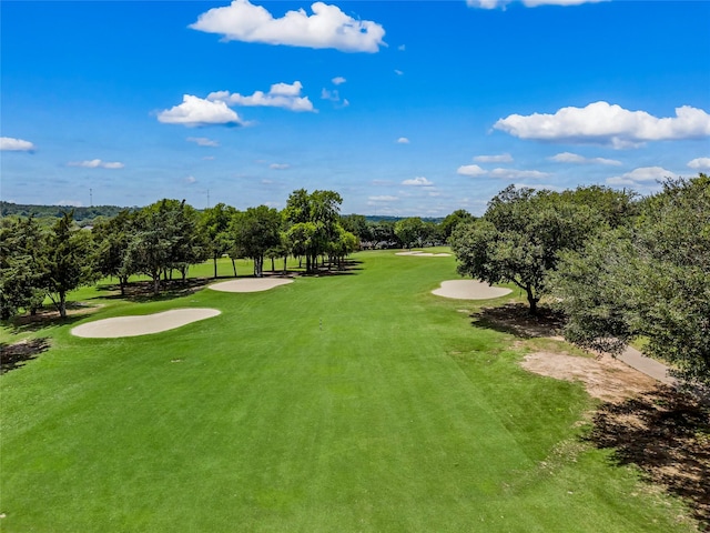 170 April Cv, Montgomery, TX 77356 - view of home's community with golf course view, view of wooded area, and a yard